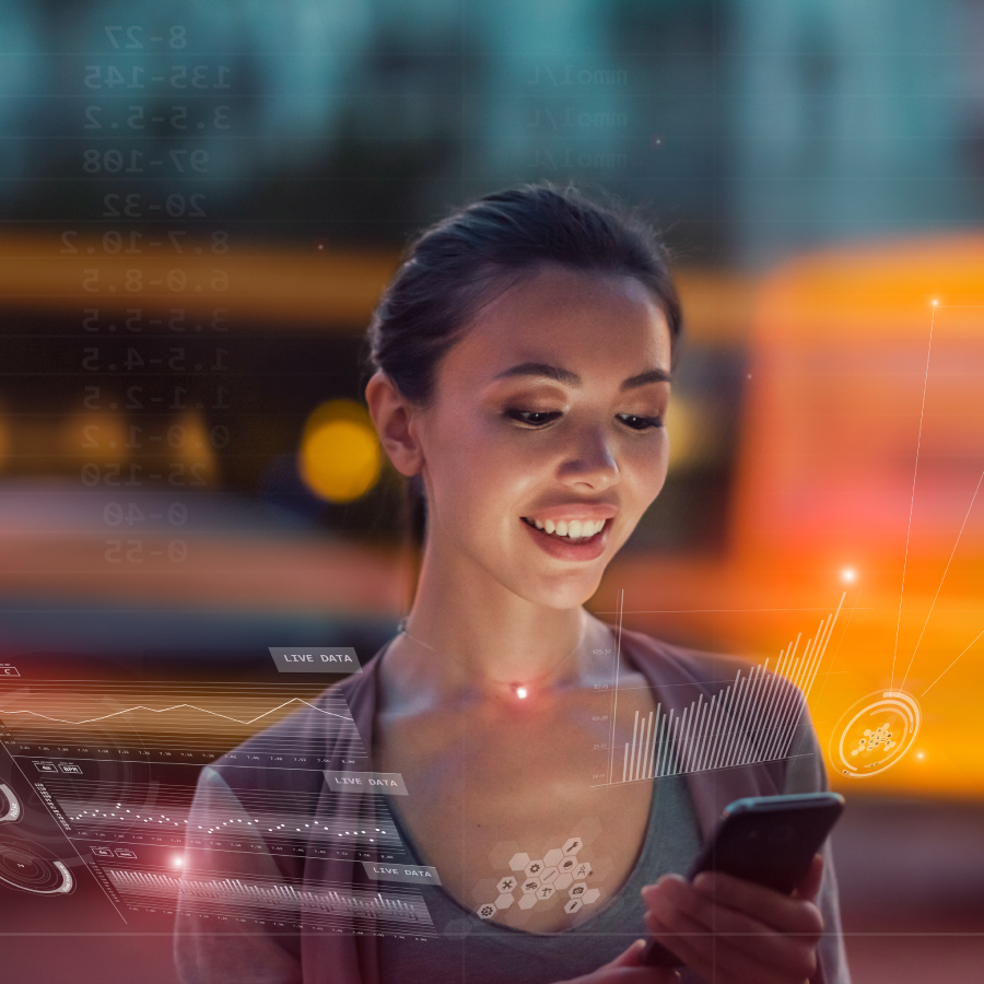 A woman engages with her phone, focused on a digital interface displayed in front of her.