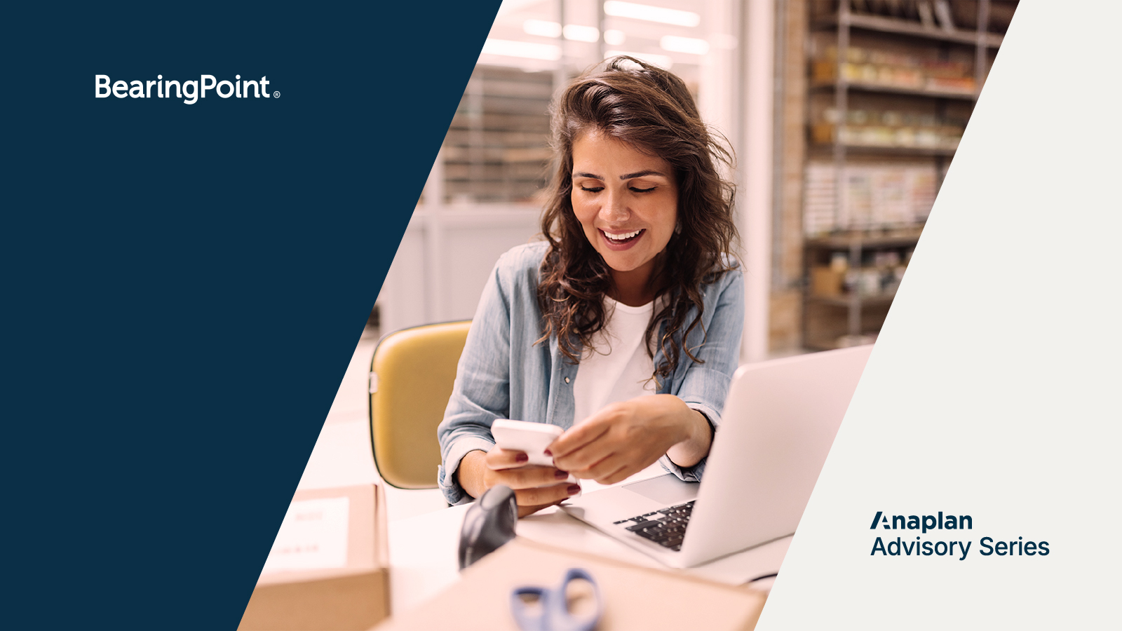 BearingPoint and Anaplan Logos displayed left and right. Image shows a smiling woman seated at a desk using a smartphone, with packages, a laptop, and retail shelving in the background—conveying a modern retail workspace.
