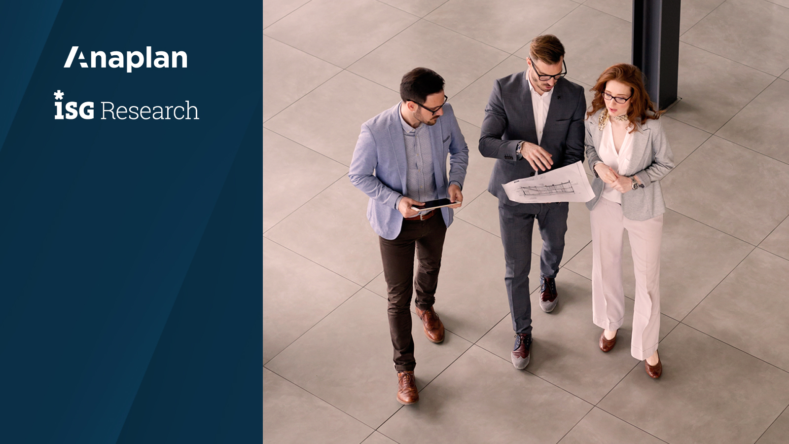 Three professionals in business attire walk together across a tiled office floor, reviewing a document and tablet. Logos for Anaplan and ISG Research displayed on the left.