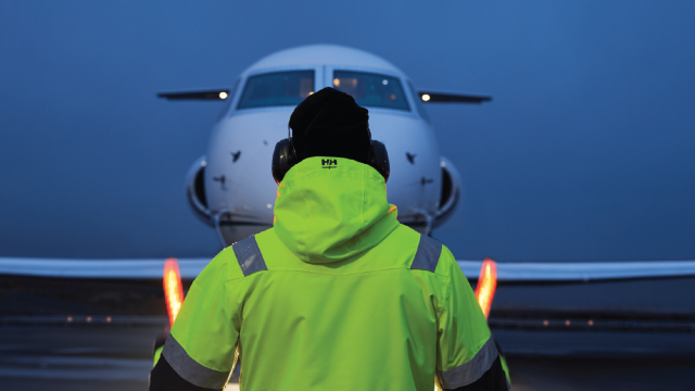 Airline employee navigating an airplane